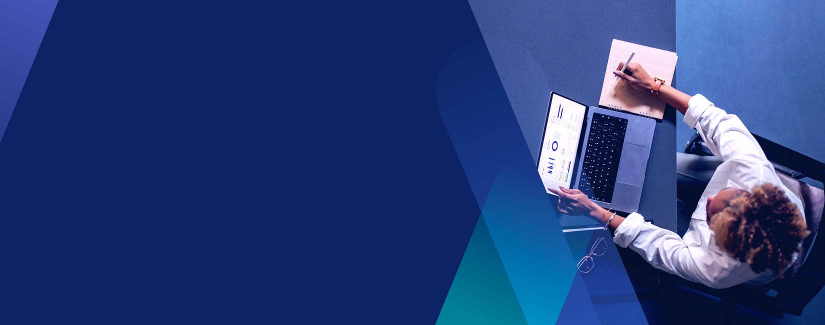  image overhead of person working at a desk 