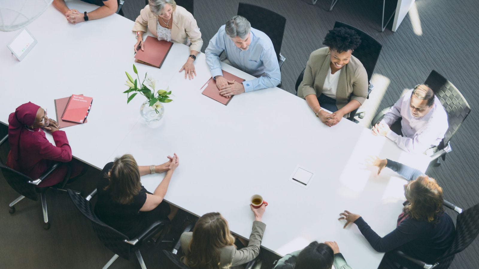 Group of Markel employees around a table in a conference room