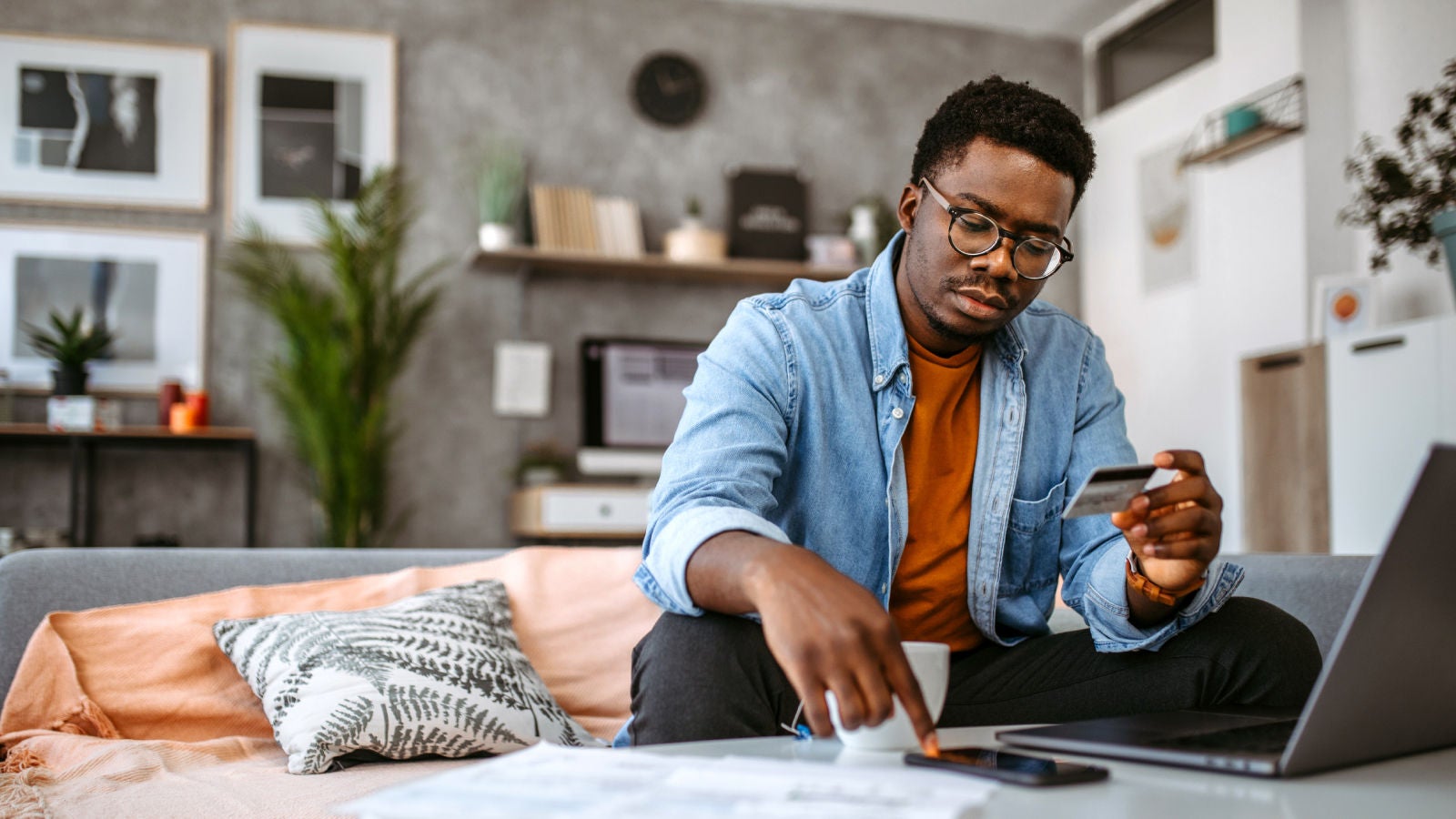 Man looking at his credit card