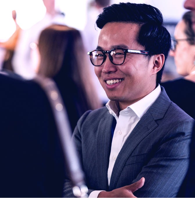 Connect Attendee taking a break in between sessions with another attendee