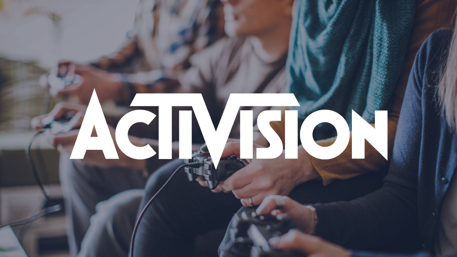 Graphic: Activision logo overlayed on group of game testers