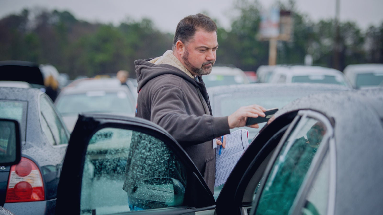 Man looking at a car