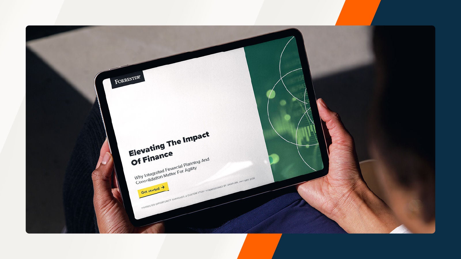 Hands holding a tablet display a Forrester report titled “Elevating The Impact Of Finance: Why Integrated Financial Planning And Consolidation Matter For Agility,” with a “Get started” button and abstract green graphics on the screen.