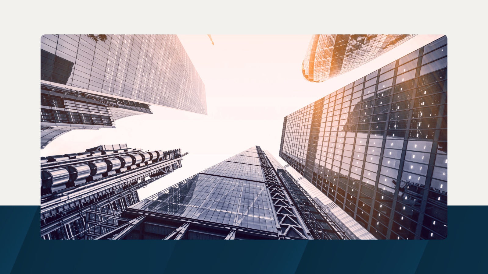 Modern skyscrapers captured from a unique low-angle perspective, showcasing architectural innovation and scale in an urban setting.