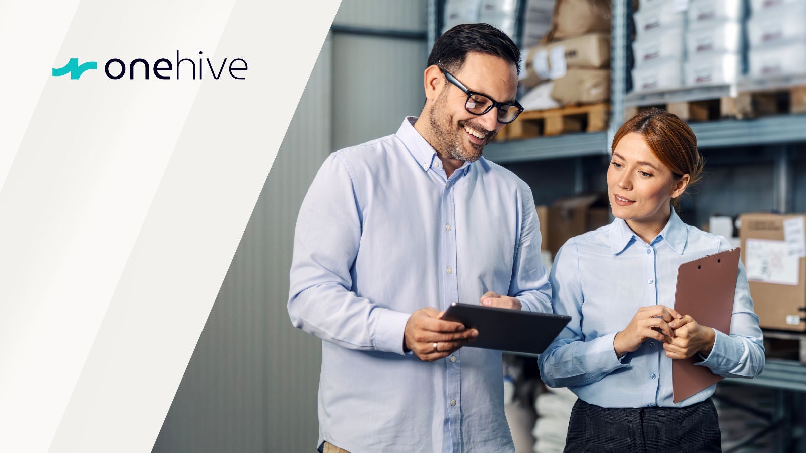 Two warehouse employees reviewing a tablet, with the onehive logo displayed on the left.