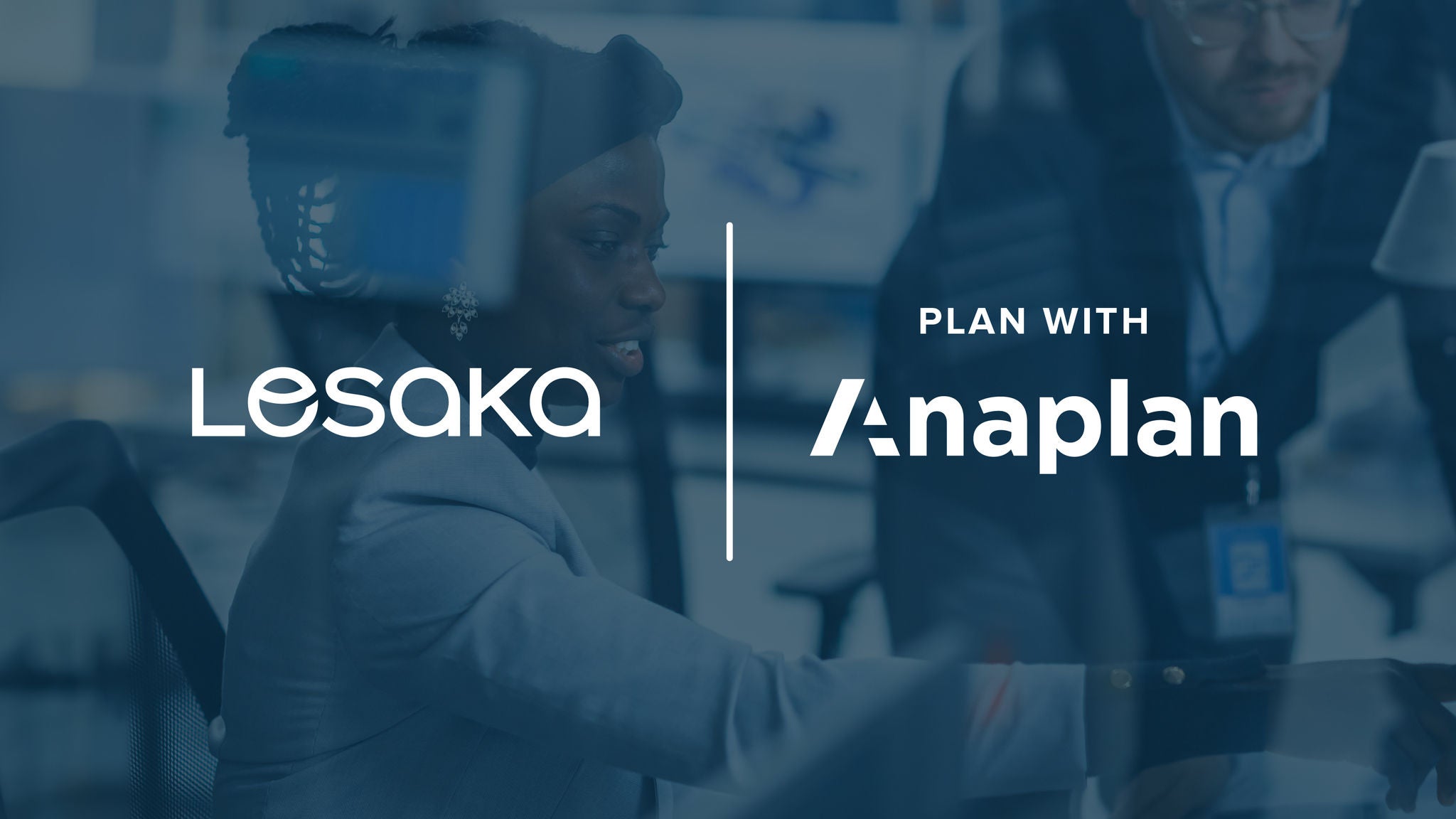 Lesaka and Plan with Anaplan logos in the center, separated by a vertical line. A professional woman engages with a colleague behind a glass partition, with a blue overlay.