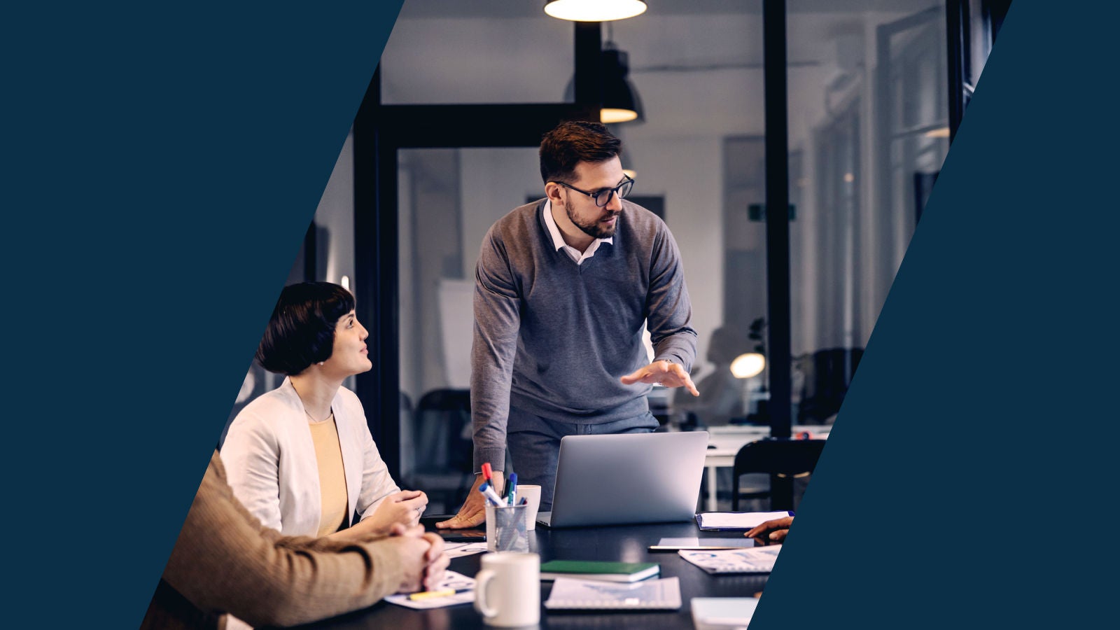 Group of coworkers having a conversation in a meeting room