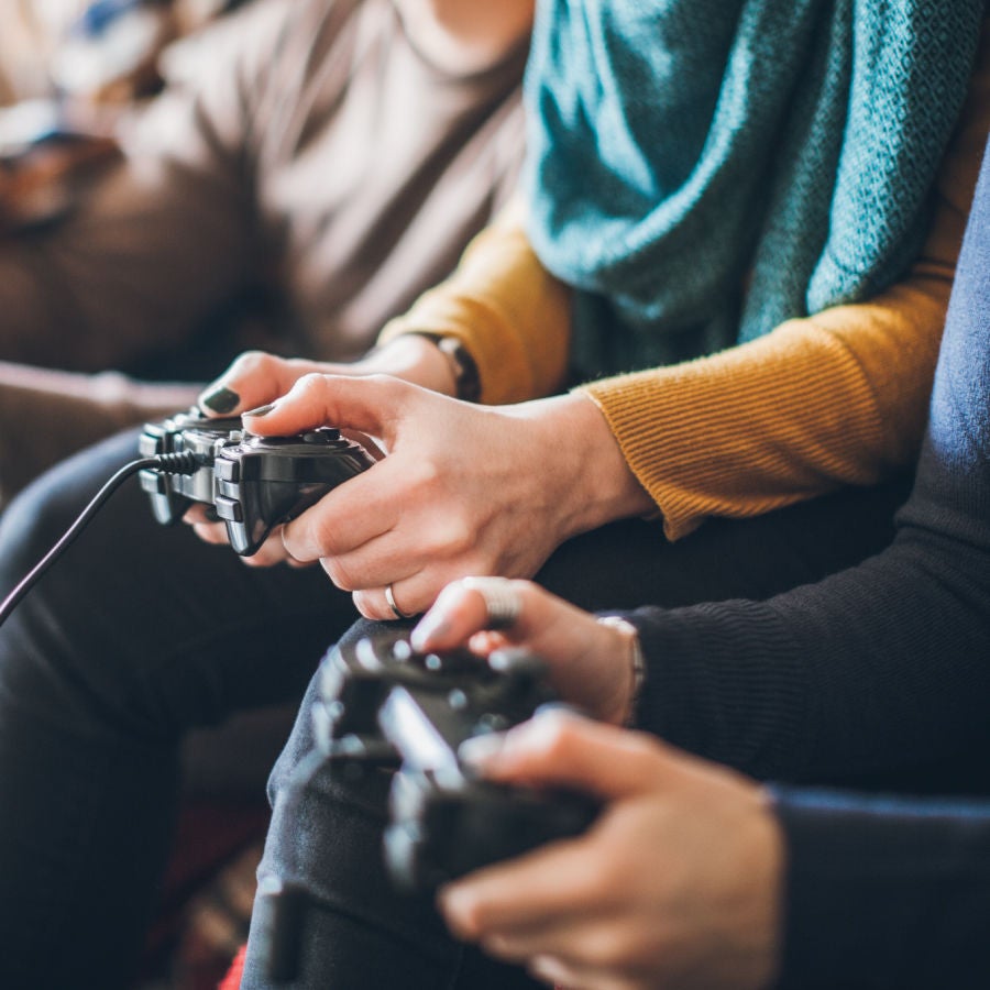 A group of friends enjoying a lively video game session together, sharing laughter and excitement.
