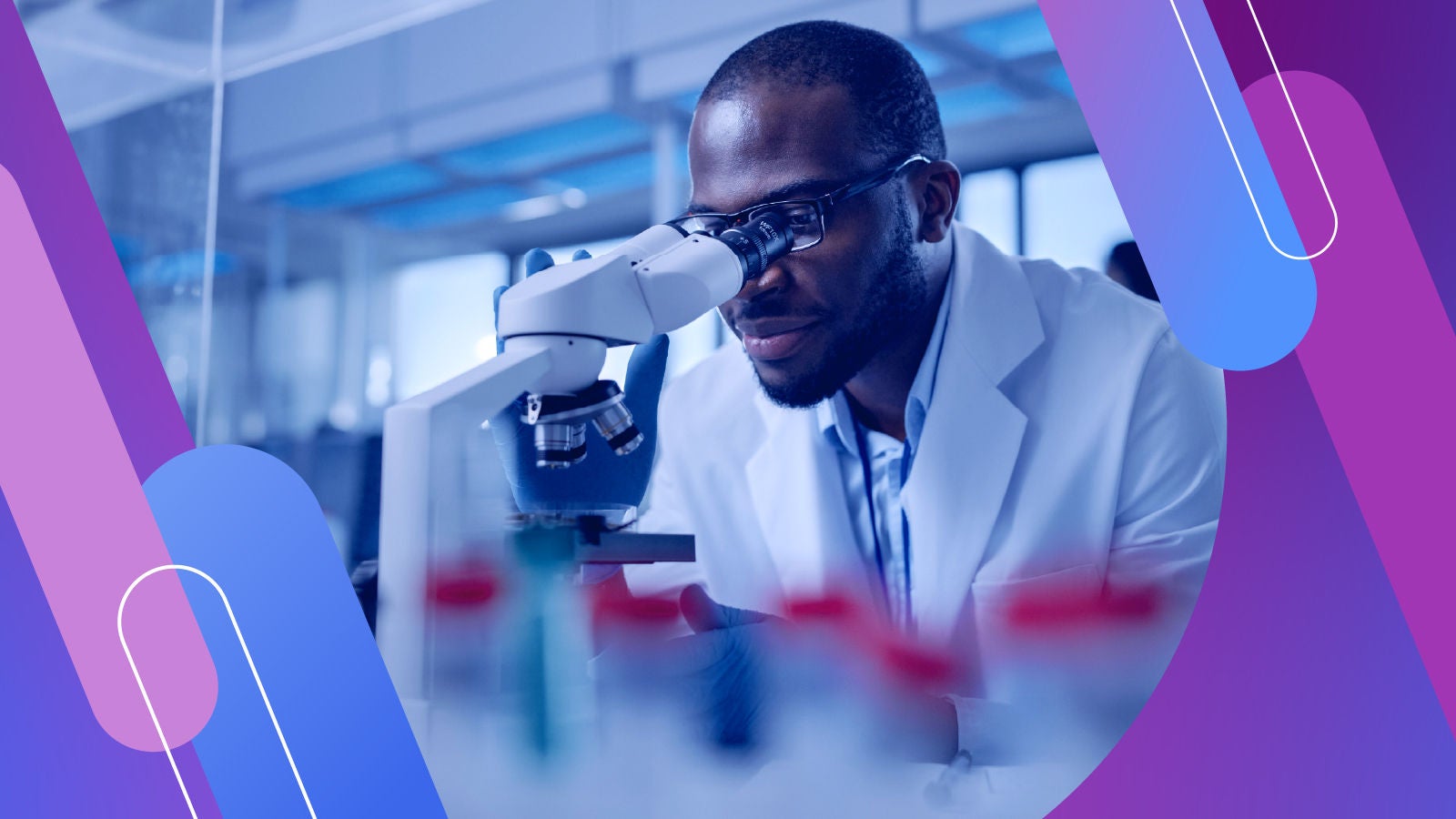 Scientist in a lab looking in a microscope