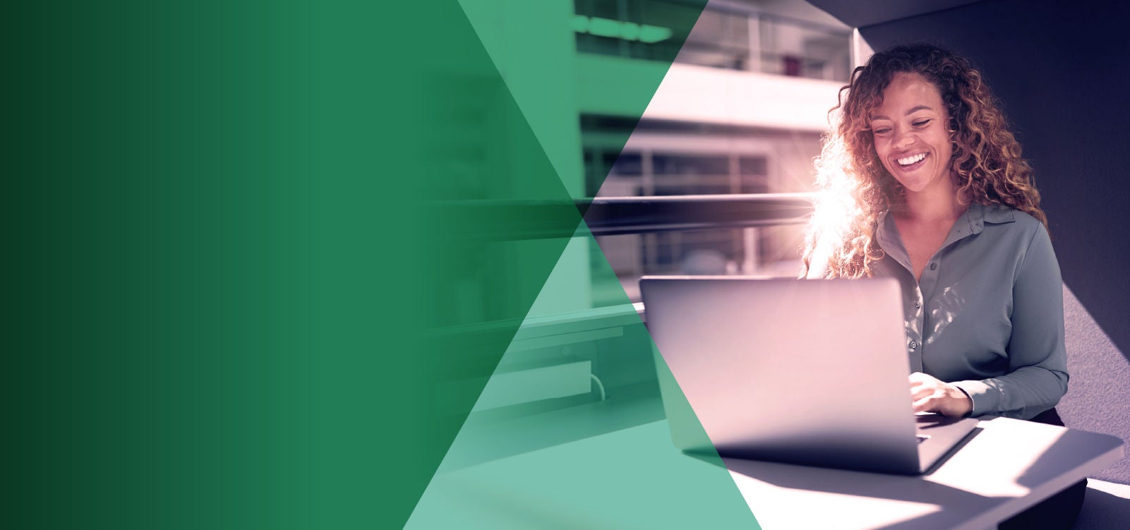 Smiling woman working at a laptop