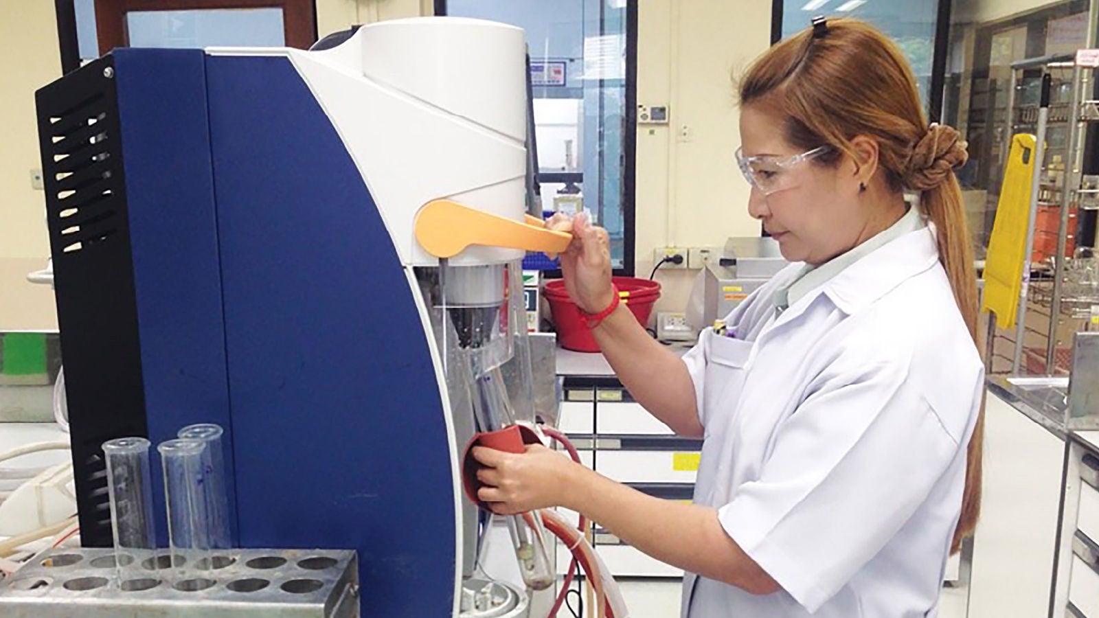 Person operating machinery at the Ajinomoto facility in Thailand.