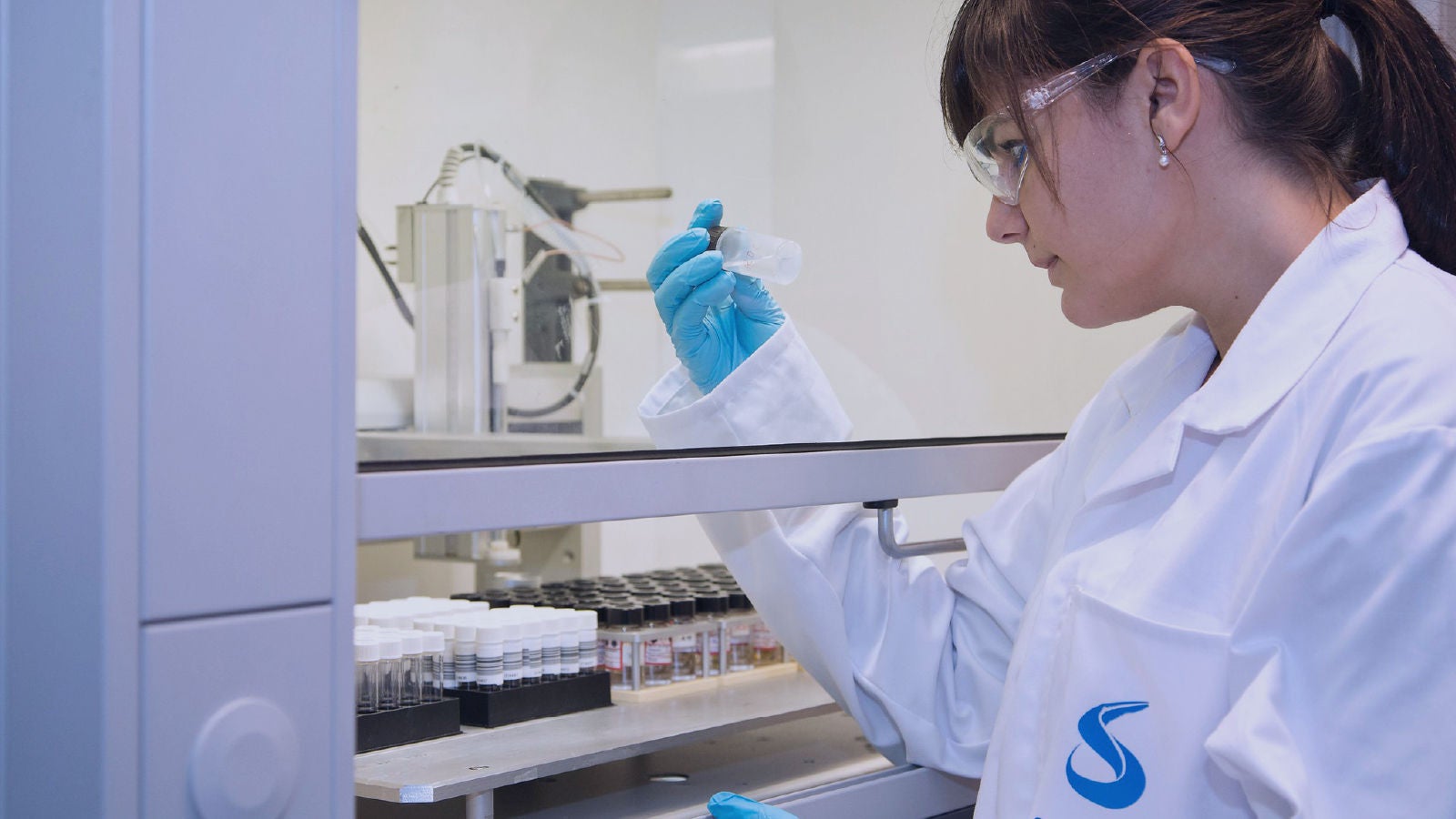 Scientist in lab in white coat