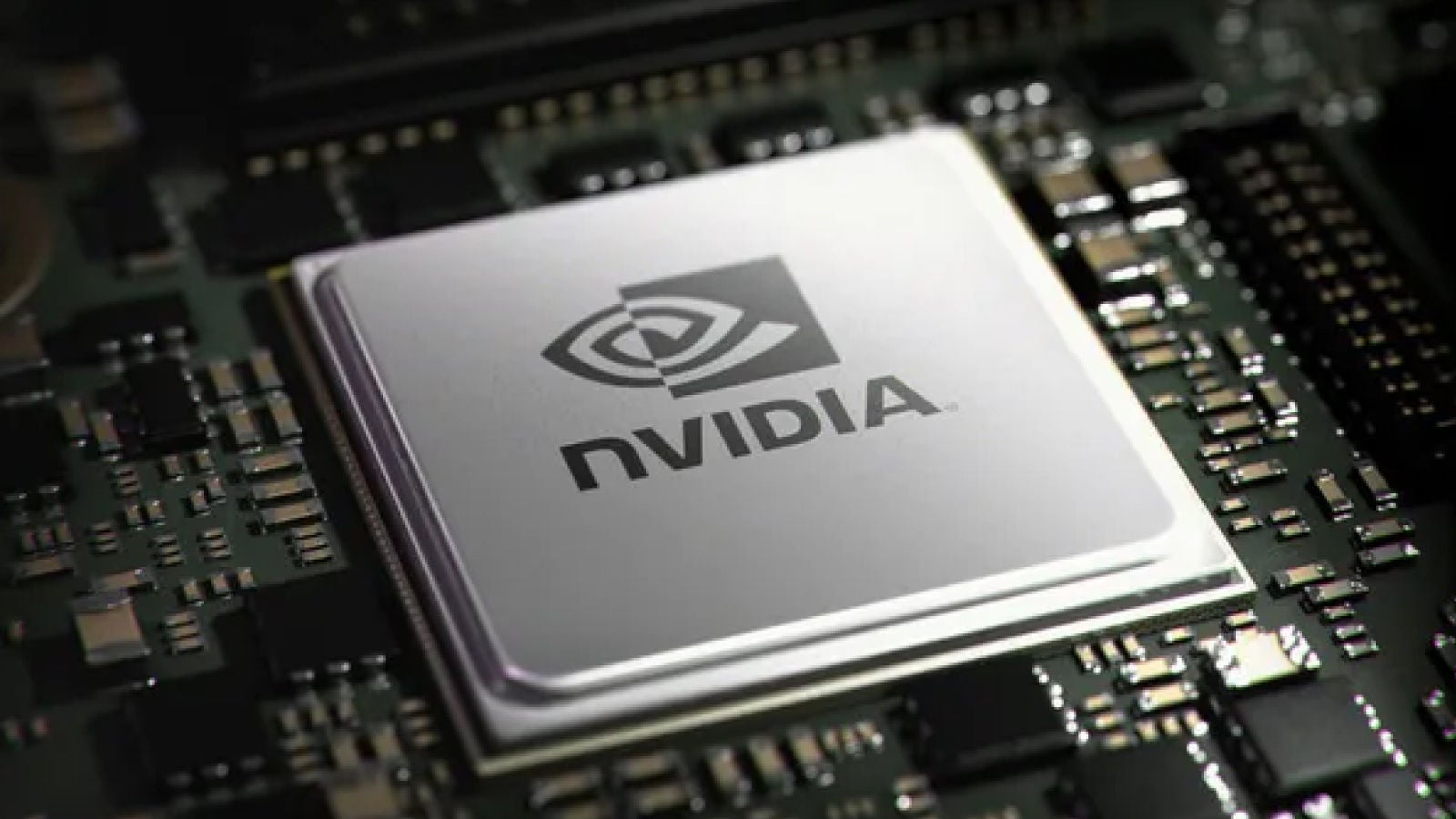 Macro shot of an NVIDIA-branded processor chip on a motherboard.