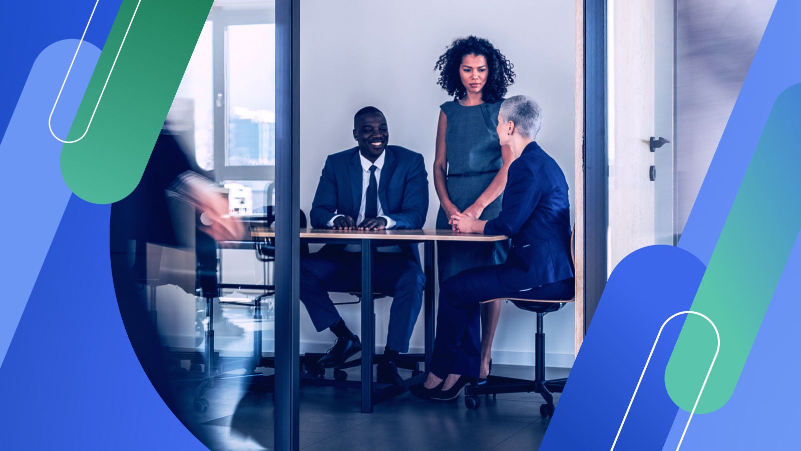 Coworkers sitting at a table in a conference room