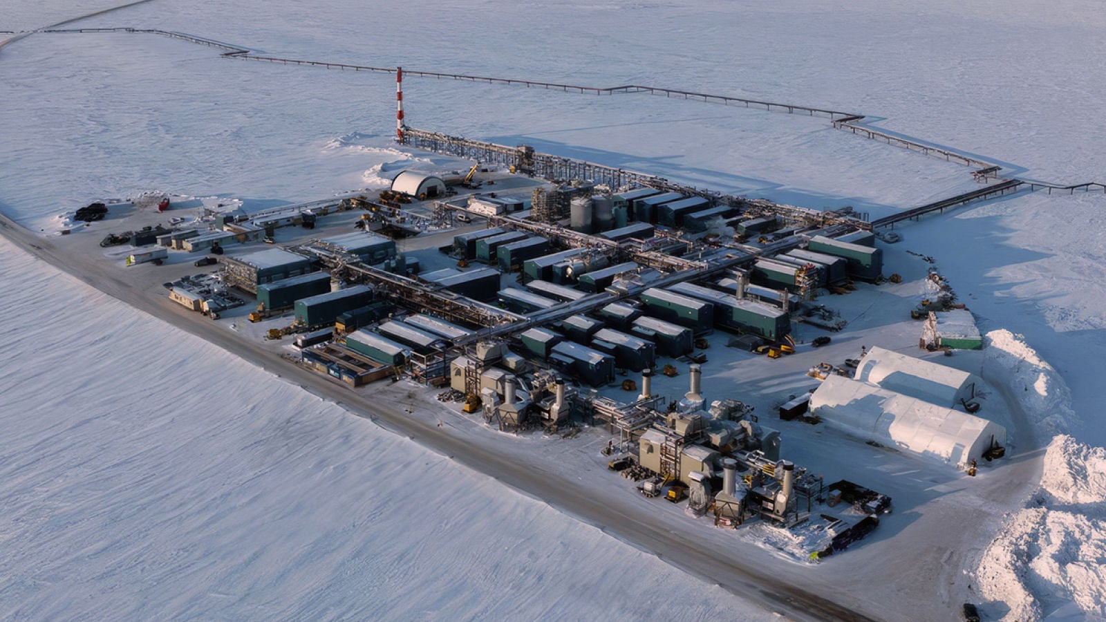 Industrial facility surrounded by snow and ice.