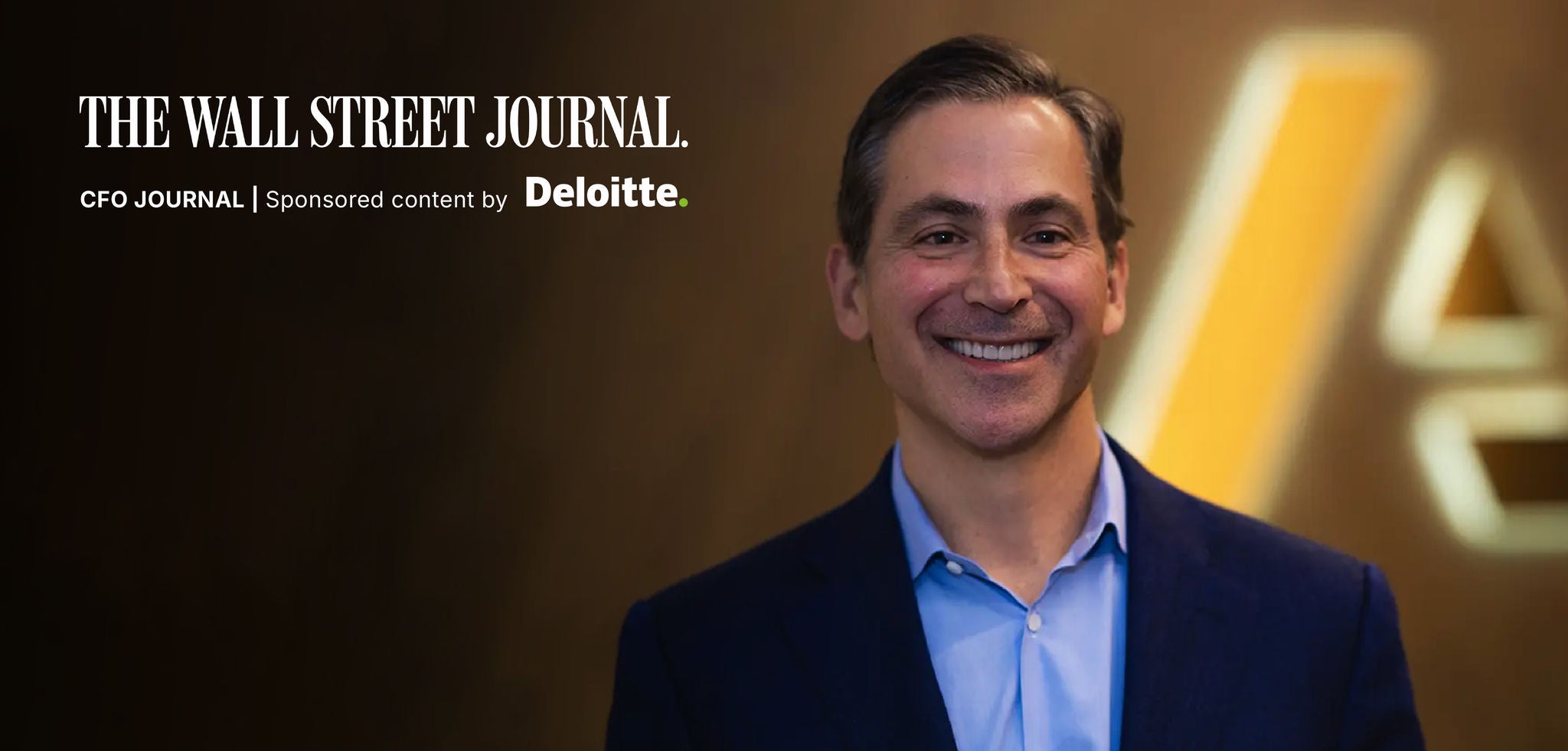 The Wall Street Journal CFO Journal banner featuring a smiling man in a blue suit with the text “The Wall Street Journal | CFO Journal | Sponsored content by Deloitte” on the left, against a blurred brown background with a yellow Anaplan logo shape behind him.