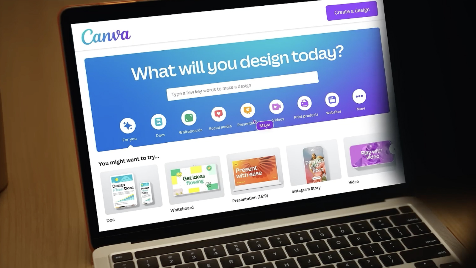 A laptop displaying the Canva homepage with the prompt “What will you design today?” and various design categories below it.