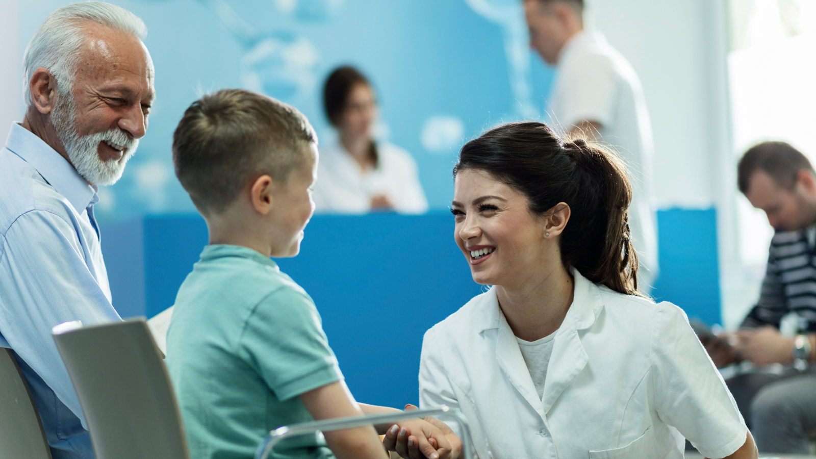 manchester-univ-NHS-customer-story-images Woman smiling at a young boy