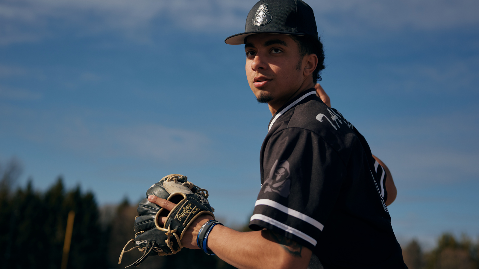 Rawlings Illustrative Photo one Person wearing Rawlings gear throwing a baseball