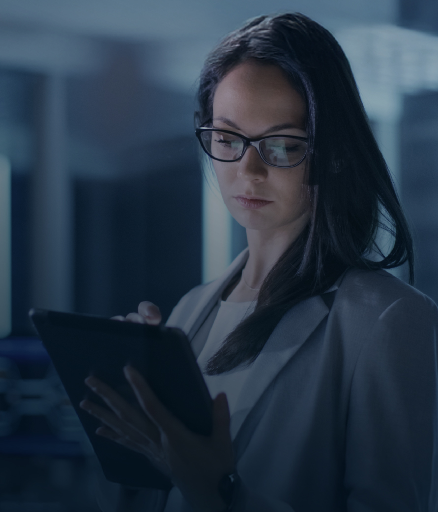 Woman wearing glasses looking at a tablet