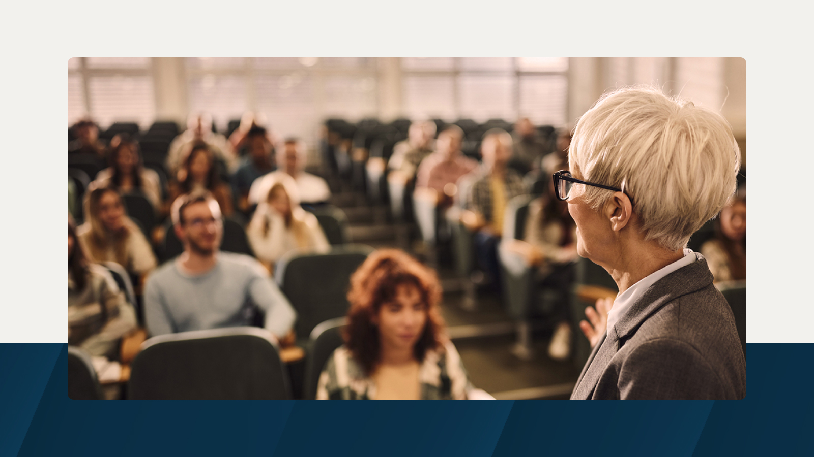 Anaplan solution brief on space planning in higher education. The text highlights the transformative power of strategic campus design, with an image of a professor addressing students in a lecture hall, representing efficient and inspiring learning environments.