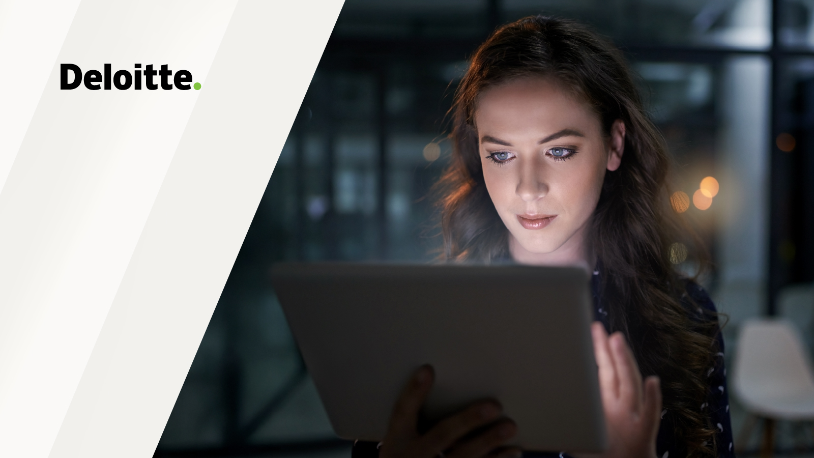 A woman seated indoors looks at a tablet in a modern office setting, with the Deloitte logo displayed on a white diagonal panel on the left side of the image.