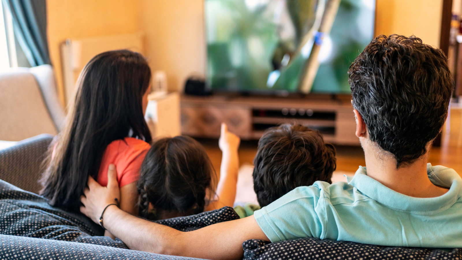 family enjoying television show