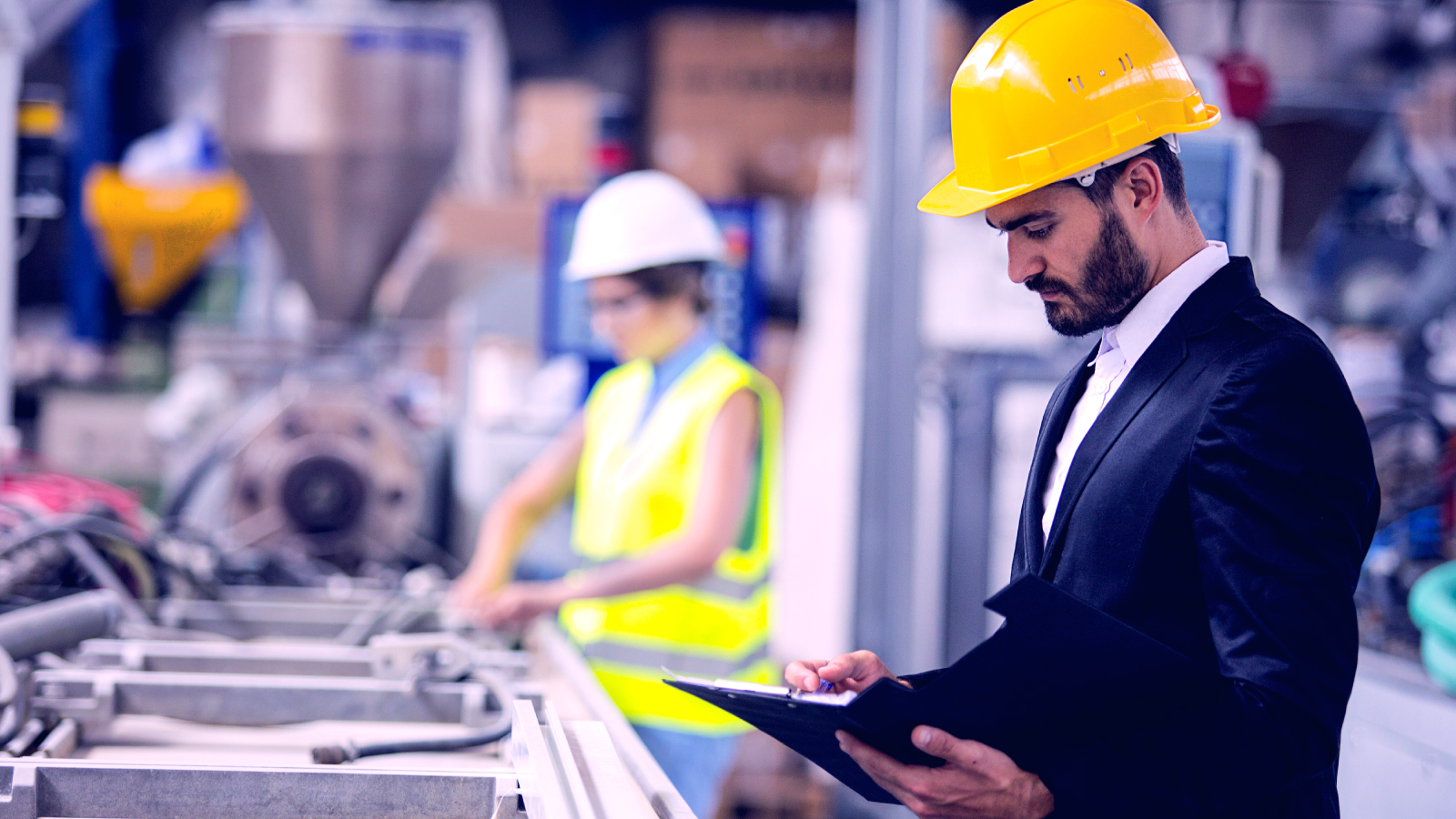 Man checking off list in warehouse