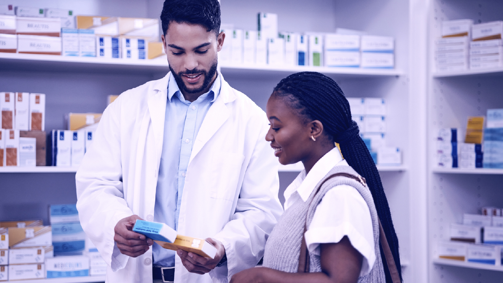 Two medical professionals in a pharmacy