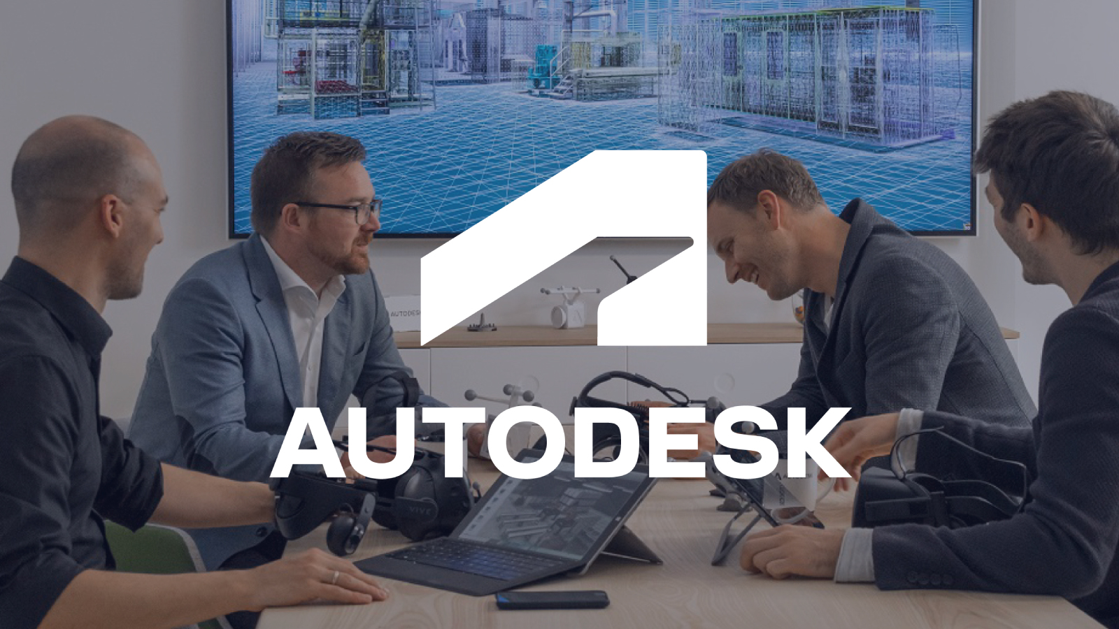 Graphic: meeting of four colleagues with the Autodesk logo overlayed