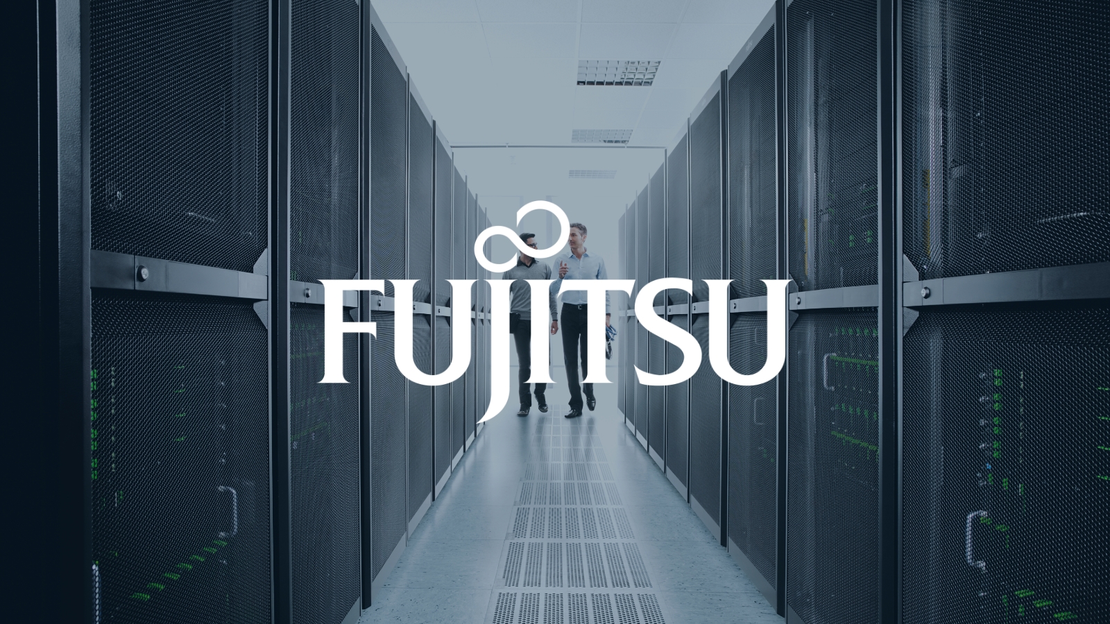Fujitsu logo on a image of business people walking in a server room