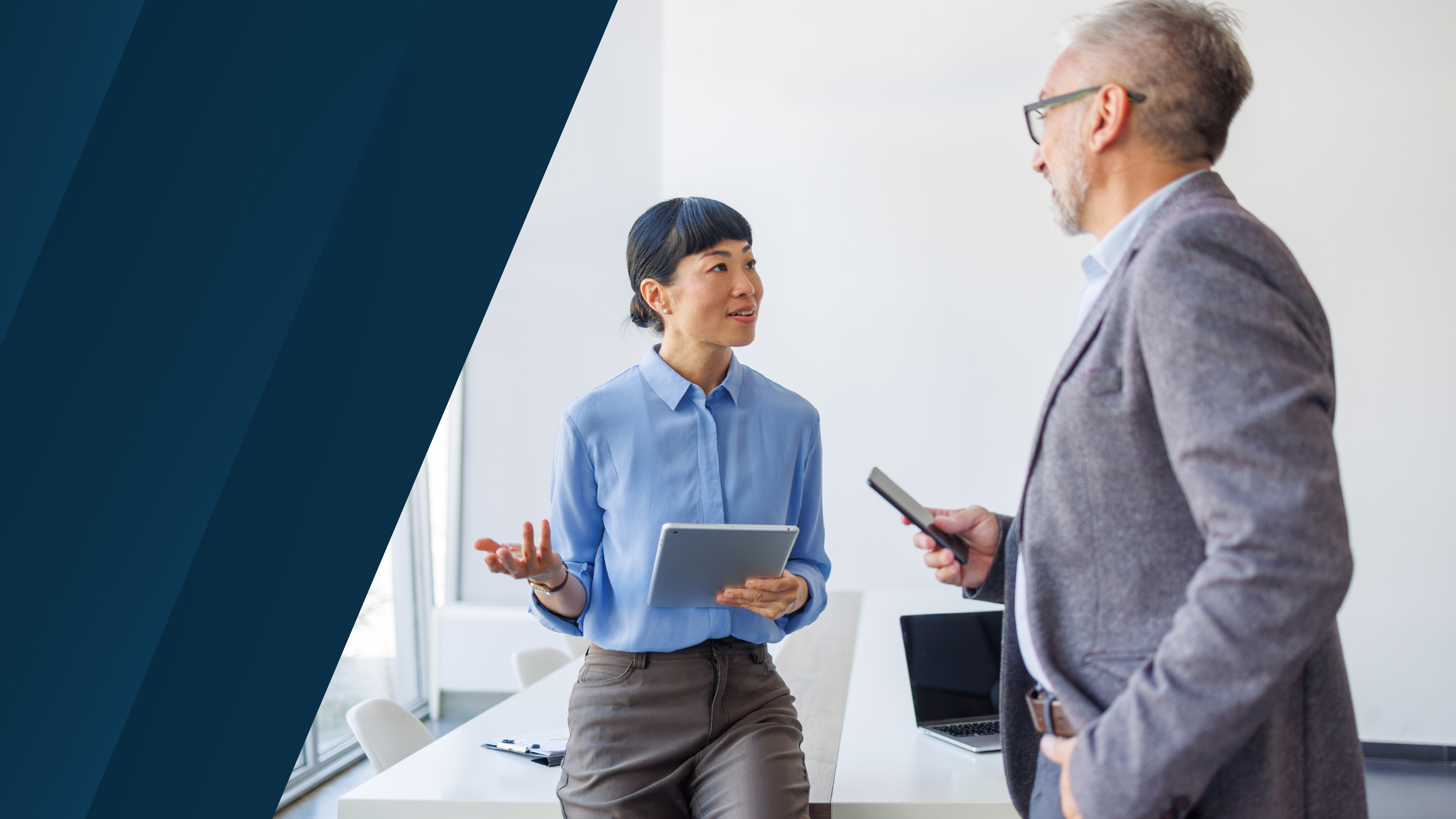 a female business person and male business person talking to each other