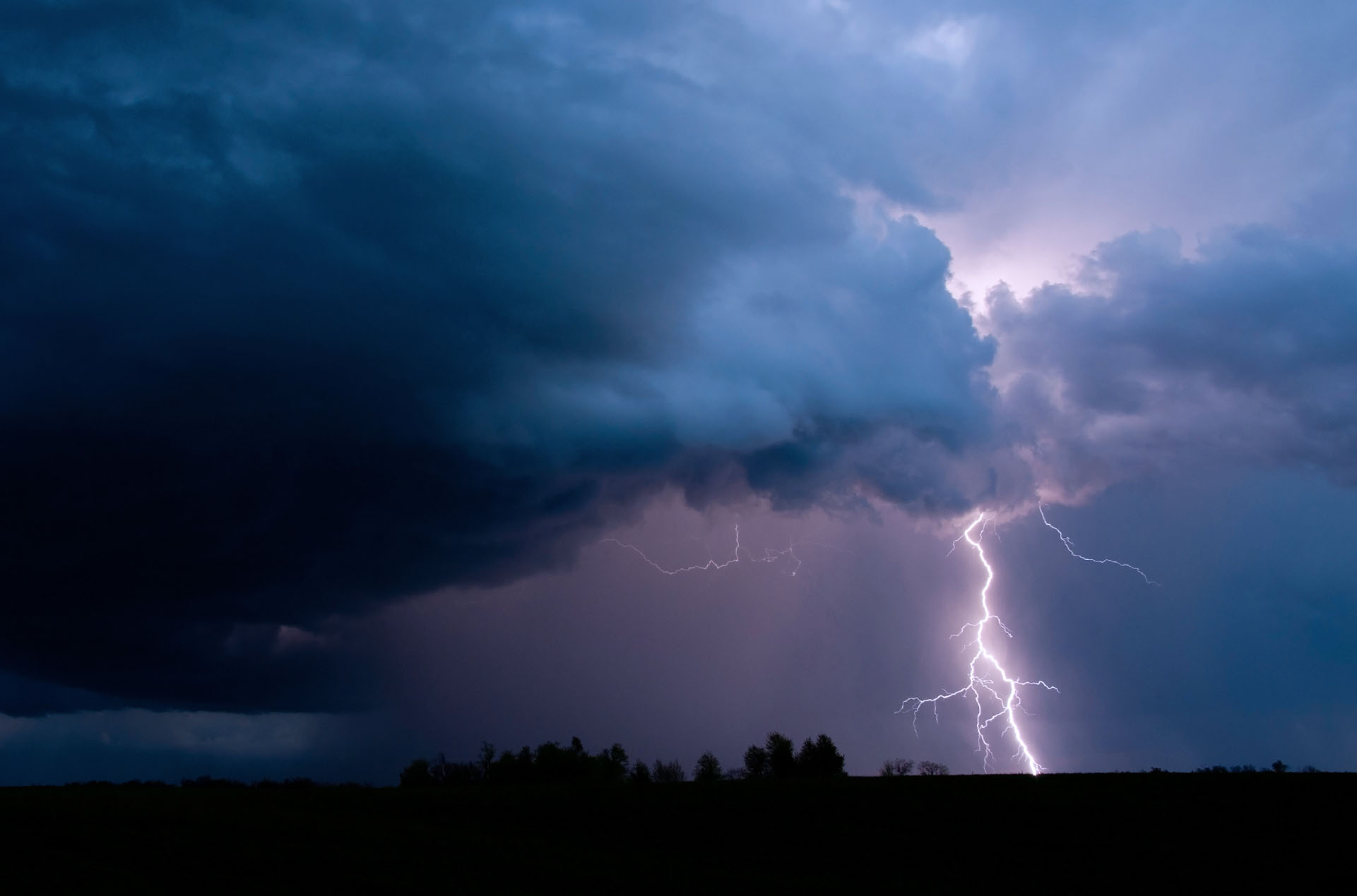 Storm with a lightning strike in the background