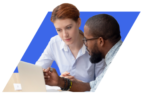 Male and female colleagues discussing information on a laptop