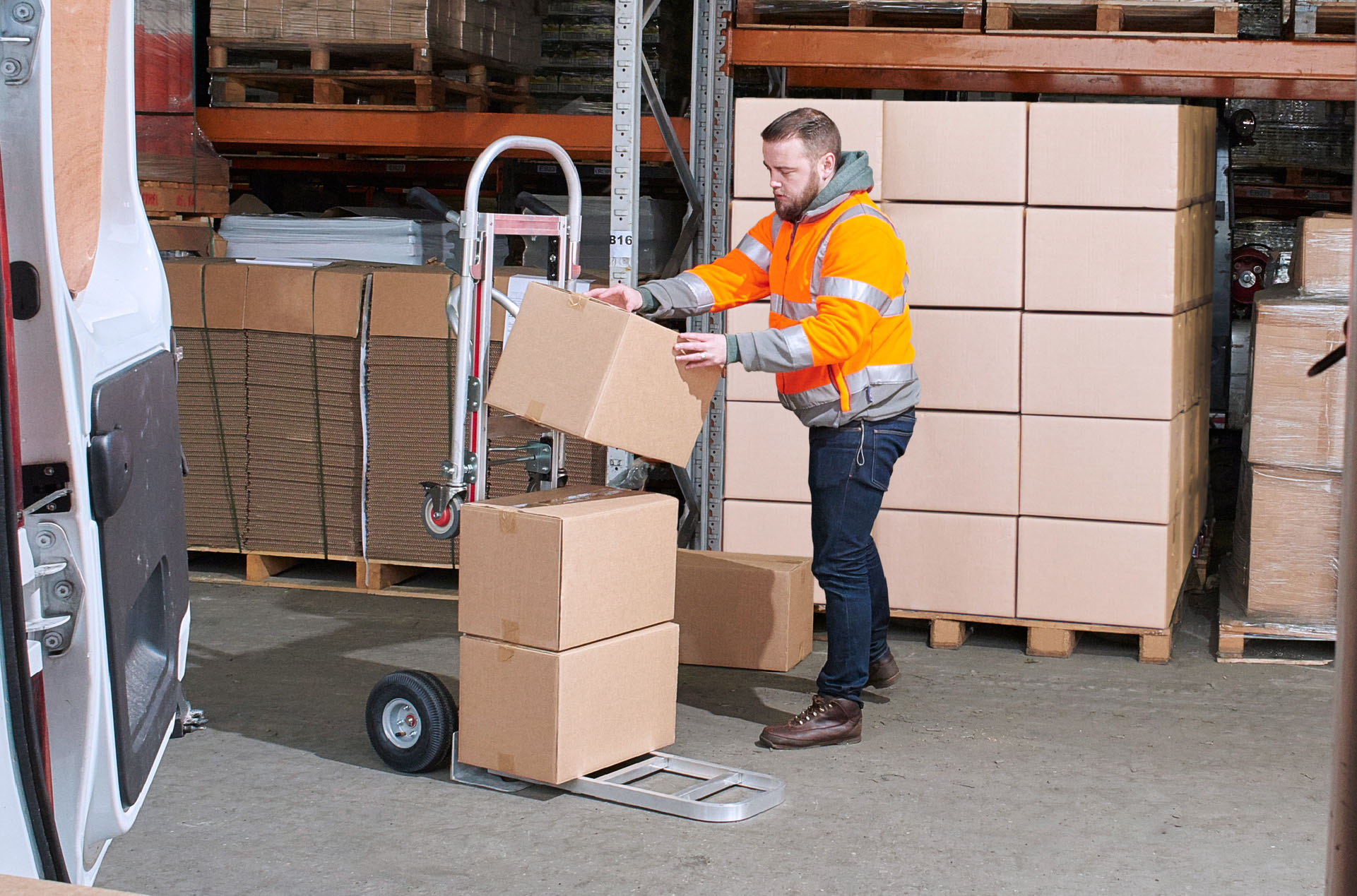 Man stacking boxes in a warehouse