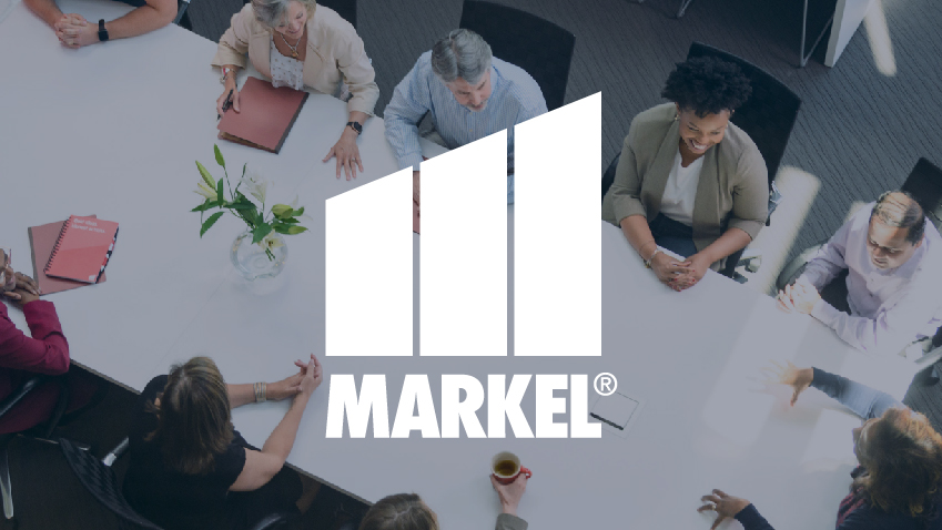 Markel Logo overlayed over image of coworkers in meeting at a long table