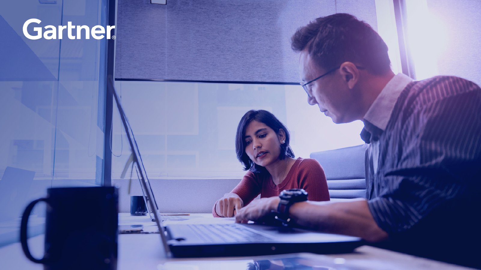 Two coworkers working together on computer