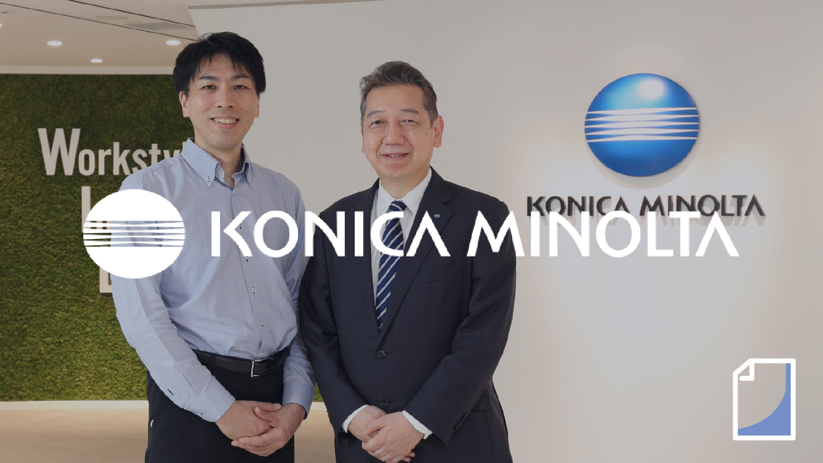Two employees smiling in the Konica Minolta office