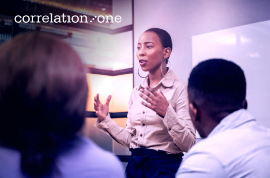 Business woman giving inspirational speech during meeting