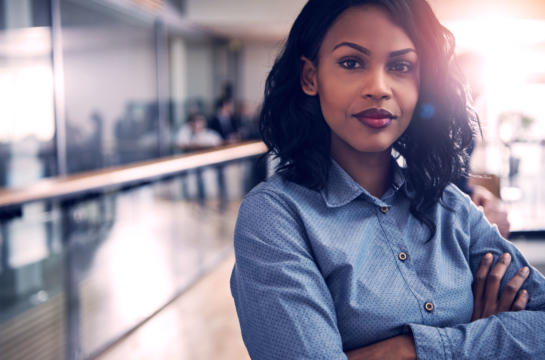 Business woman looking at camera with determination