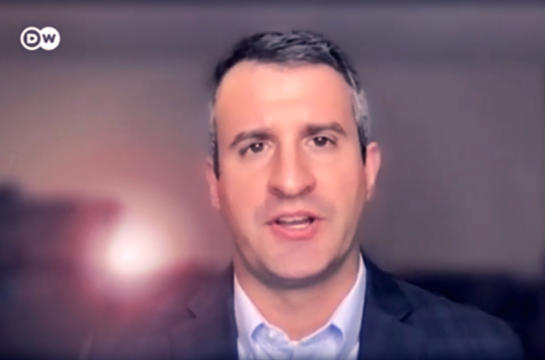 Evan Quasney talking into camera